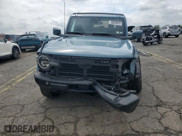 2023 Ford Bronco z VIN 1FMEE5DP9PLB17477, wystawiony jako Copart lot #58829615 z przebiegiem 22 069 mil mil oraz Szkoda całkowita • Salvage title. Historia ofert i sprzedaży dostępna na DreamBid. Obrazek 5.