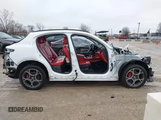 2019 Alfa Romeo Stelvio z VIN ZASPAKAN8K7C38424, wystawiony jako IAAI lot #41476001 z przebiegiem Nie podano mil oraz . Historia ofert i sprzedaży dostępna na DreamBid. Obrazek 14.