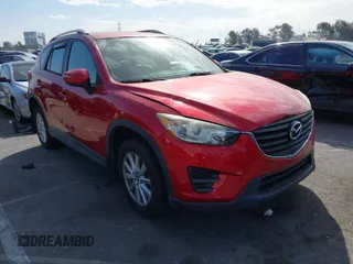 2016 Mazda CX-5 Sport with VIN JM3KE2BY4G0701442, listed as a IAAI auction lot 41682335 with 125,624 mi miles. Bid and sale history available at carsss.com. Image 1.