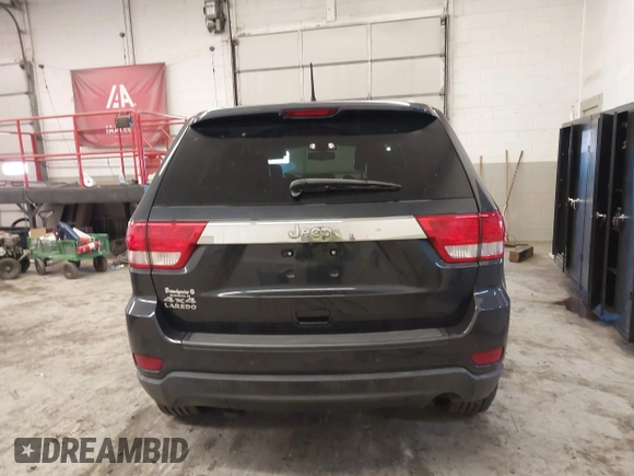 2012 Jeep Grand Cherokee Laredo with VIN 1C4RJFAG5CC351539, listed as a IAAI auction lot 41861533 with 166,909 mi miles. Bid and sale history available at carsss.com. Image 16.