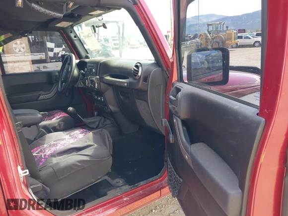 2012 Jeep Wrangler Unlimited Sport z VIN 1C4BJWDG8CL258625, wystawiony jako IAAI lot #42266102 z przebiegiem 58 594 mil mil oraz . Historia ofert i sprzedaży dostępna na DreamBid. Obrazek 5.