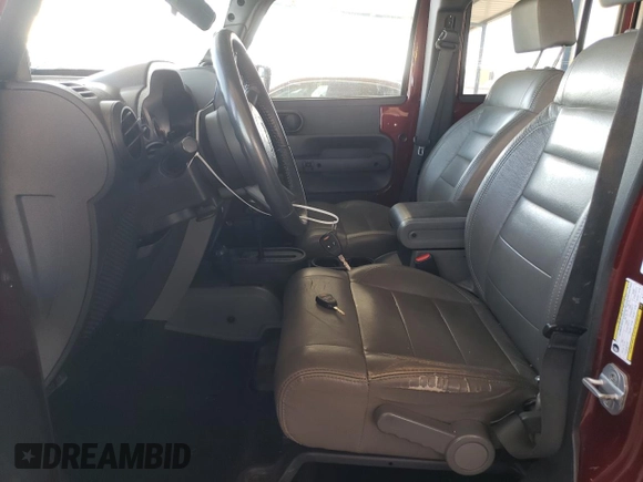 2010 Jeep Wrangler Unlimited Rubicon with VIN 1J4BA6H18AL197855, listed as a Copart auction lot 57748185 with 147,899 mi miles and Salvage title. Bid and sale history available at DreamBid. Image 7.