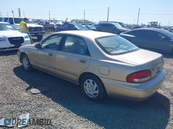 1999 Mazda 626 ES z VIN 1YVGF22C5X5811946, wystawiony jako IAAI lot #41970165 z przebiegiem 126 709 mil mil oraz . Historia ofert i sprzedaży dostępna na DreamBid. Obrazek 3.