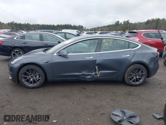2019 Tesla Model 3 Mid Range with VIN 5YJ3E1EA3KF307415, listed as a IAAI auction lot 41673239 with 42,895 mi miles and . Bid and sale history available at DreamBid. Image 14.