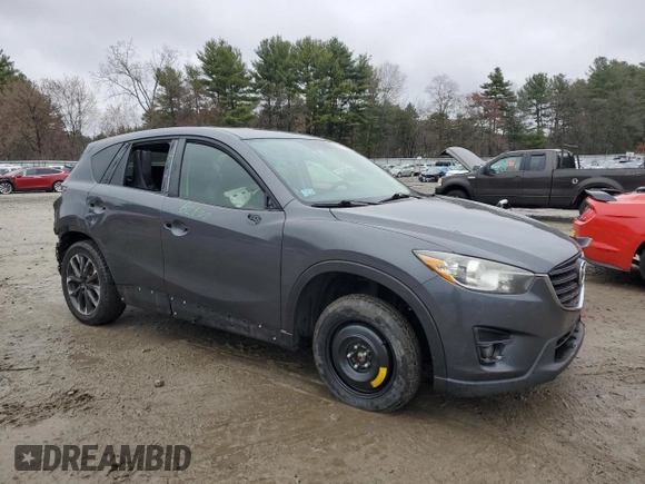 2016 Mazda CX-5 Grand Touring with VIN JM3KE4DY6G0834583, listed as a Copart auction lot 52015905 with 184,741 mi miles and Salvage Title. Bid and sale history available at DreamBid. Image 4.