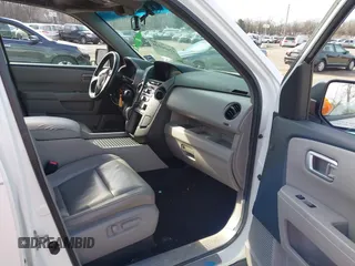 2014 Honda Pilot EX-L with VIN 5FNYF3H59EB003409, listed as a IAAI auction lot 41666126 with 170,658 mi miles. Bid and sale history available at carsss.com. Image 5.