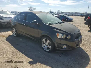 2014 Chevrolet Sonic LTZ with VIN 1G1JE5SB9E4103444, listed as a Copart auction lot 46949955 with 120,986 mi miles and Clean Title. Bid and sale history available at carsss.com. Image 4.