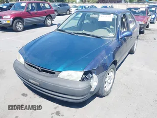 1998 Toyota Corolla VE z VIN 2T1BR18E4WC099280, wystawiony jako IAAI lot #42624278 z przebiegiem 129 901 mil mil oraz . Historia ofert i sprzedaży dostępna na DreamBid. Obrazek 6.