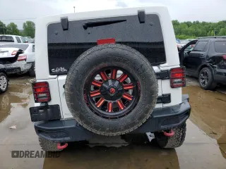 2018 Jeep Wrangler JK Unlimited Rubicon with VIN 1C4BJWFG8JL867448, listed as a Copart auction lot 65513584 with 109,440 mi miles and Salvage Title. Bid and sale history available at carsss.com. Image 6.