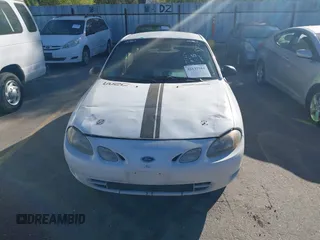 1999 Ford Escort Cool z VIN 3FAKP1137XR175834, wystawiony jako IAAI lot #42137584 z przebiegiem 222 398 mil mil oraz . Historia ofert i sprzedaży dostępna na DreamBid. Obrazek 6.