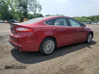 2013 Ford Fusion SE Hybrid z VIN 3FA6P0LUXDR335590, wystawiony jako Copart lot #60541395 z przebiegiem 121 975 mil mil oraz Szkoda całkowita • Salvage title. Historia ofert i sprzedaży dostępna na DreamBid. Obrazek 3.