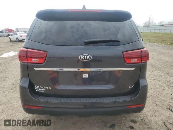 2021 Kia Sedona LX with VIN KNDMB5C17M6665266, listed as a Copart auction lot 48129495 with 57,274 mi miles and Salvage Title. Bid and sale history available at carsss.com. Image 6.