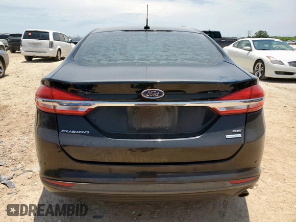 2018 Ford Fusion SE z VIN 3FA6P0HD5JR252718, wystawiony jako Copart lot #60549335 z przebiegiem 120 807 mil mil oraz Czysty tytuł • Clean title. Historia ofert i sprzedaży dostępna na DreamBid. Obrazek 6.