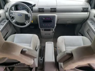2005 Ford Freestar SE z VIN 2FMZA51615BA67146, wystawiony jako Copart lot #71000634 z przebiegiem 84 096 mil mil oraz Szkody całkowita. Historia ofert i sprzedaży dostępna na DreamBid. Obrazek 8.
