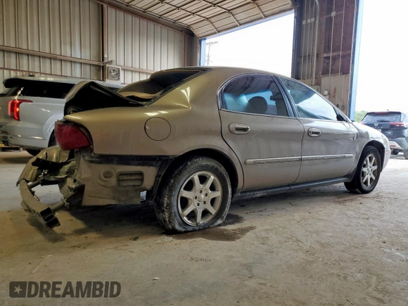 2002 Mercury Sable GS z VIN 1MEFM50U02G652804, wystawiony jako Copart lot #57405035 z przebiegiem 264 042 mil mil oraz Szkody całkowita. Historia ofert i sprzedaży dostępna na DreamBid. Obrazek 3.