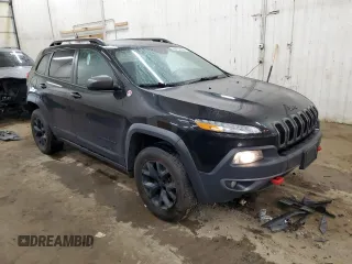 2015 Jeep Cherokee Trailhawk z VIN 1C4PJMBS0FW598694, wystawiony jako Copart lot #60731615 z przebiegiem 130 219 mil mil oraz Czysty tytuł • Clean title. Historia ofert i sprzedaży dostępna na DreamBid. Obrazek 4.