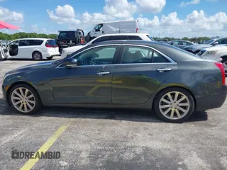 2014 Cadillac ATS Luxury RWD z VIN 1G6AB5RAXE0142079, wystawiony jako IAAI lot #42517963 z przebiegiem 140 118 mil mil oraz . Historia ofert i sprzedaży dostępna na DreamBid. Obrazek 6.