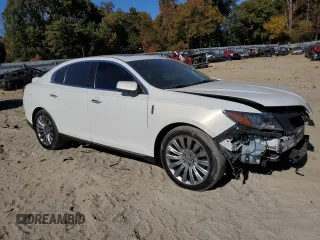 2013 Lincoln MKS z VIN 1LNHL9DK0DG605400, wystawiony jako Copart lot #77071034 z przebiegiem 73 450 mil mil oraz Szkoda całkowita • Salvage title. Historia ofert i sprzedaży dostępna na DreamBid. Obrazek 4.