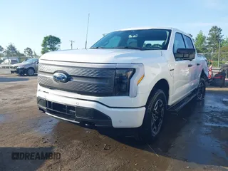 2023 Ford F-150 Lightning Pro with VIN 1FTVW1EL6PWG34059, listed as a IAAI auction lot 42010900 with 20,759 mi miles and . Bid and sale history available at DreamBid. Image 2.
