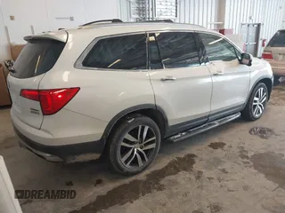 2017 Honda Pilot Touring with VIN 5FNYF6H92HB032873, listed as a IAAI auction lot 41608870 with 123,888 mi miles. Bid and sale history available at carsss.com. Image 4.