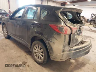 2015 Mazda CX-5 Sport with VIN JM3KE4BY0F0542655, listed as a IAAI auction lot 41471568 with 165,386 mi miles. Bid and sale history available at carsss.com. Image 3.