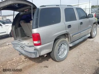 2003 Chevrolet Tahoe LS with VIN 1GNEC13V03R272663, listed as a IAAI auction lot 41933407 with 245,113 mi miles. Bid and sale history available at carsss.com. Image 4.