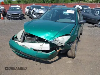 2002 Ford Focus ZX5 z VIN 3FAFP373X2R130965, wystawiony jako IAAI lot #42216638 z przebiegiem 59 236 mil mil oraz . Historia ofert i sprzedaży dostępna na DreamBid. Obrazek 6.