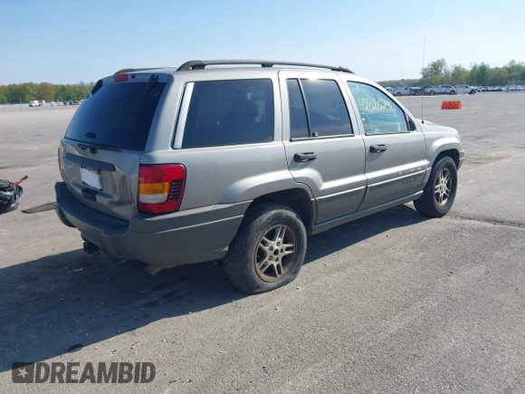 2002 Jeep Grand Cherokee with VIN 1J8GW48N72C207838, listed as a IAAI auction lot 42020294 with 181,283 mi miles and . Bid and sale history available at DreamBid. Image 4.