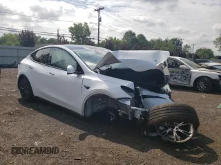 2024 Tesla Model Y with VIN 7SAYGDED9RF133701, listed as a Copart auction lot 64060785 with Not provided miles and Salvage title. Bid and sale history available at DreamBid. Image 4.
