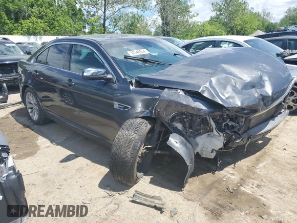2015 Ford Taurus Limited z VIN 1FAHP2F87FG170997, wystawiony jako Copart lot #54346554 z przebiegiem Nie podano mil oraz Szkoda całkowita • Salvage title. Historia ofert i sprzedaży dostępna na DreamBid. Obrazek 4.