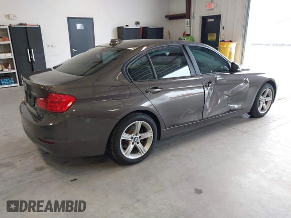 2015 BMW 3 Series 328i with VIN WBA3A5C57FF609734, listed as a IAAI auction lot 41392336 with 121,378 mi miles. Bid and sale history available at carsss.com. Image 4.
