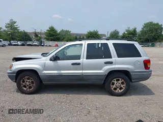 2002 Jeep Grand Cherokee Laredo with VIN 1J4GW48SX2C313093, listed as a IAAI auction lot 42446559 with 200,319 mi miles and . Bid and sale history available at DreamBid. Image 14.