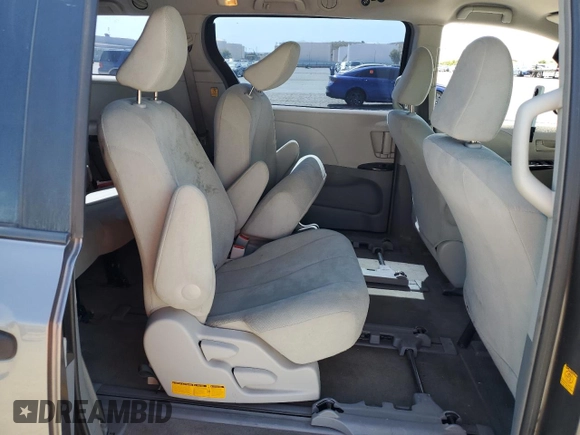 2012 Toyota Sienna с VIN 5TDZK3DC0CS190388, выставлен на аукционе Copart как лот 58564315 с пробегом 256 936 миль миль и Списание • Salvage title. История ставок и продаж доступна на DreamBid. Изображение 11.