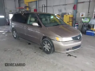 2003 Honda Odyssey EX-L with VIN 5FNRL18923B117592, listed as a IAAI auction lot 41546119 with 212,755 mi miles and . Bid and sale history available at DreamBid. Image 1.