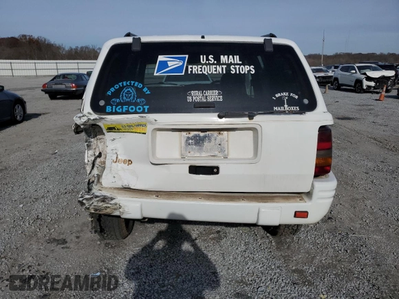 1996 Jeep Grand Cherokee Limited с VIN 1J4GZ78S2TY123592, выставлен на аукционе Copart как лот 84387624 с пробегом Не указан миль и Списание • Salvage title. История ставок и продаж доступна на DreamBid. Изображение 6.