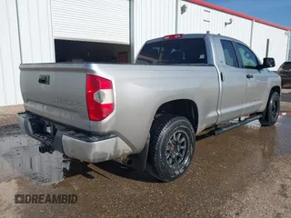 2014 Toyota Tundra SR with VIN 5TFRM5F13EX078411, listed as a IAAI auction lot 42702477 with 123,336 mi miles and . Bid and sale history available at DreamBid. Image 4.