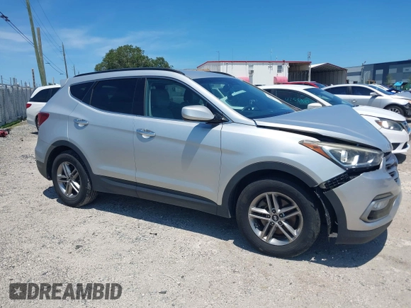 2017 Hyundai Santa Fe 2.4L with VIN 5XYZU3LB7HG407524, listed as a IAAI auction lot 42580597 with 117,311 mi miles and . Bid and sale history available at DreamBid. Image 1.