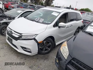 2020 Honda Odyssey Touring with VIN 5FNRL6H81LB028083, listed as a IAAI auction lot 42003810 with 71,536 mi miles and . Bid and sale history available at DreamBid. Image 2.