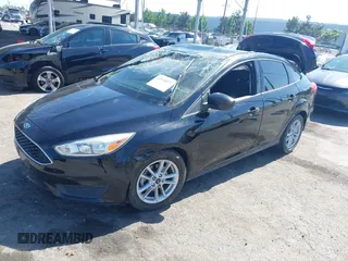 2018 Ford Focus SE z VIN 1FADP3FE9JL303933, wystawiony jako IAAI lot #42530171 z przebiegiem Nie podano mil oraz . Historia ofert i sprzedaży dostępna na DreamBid. Obrazek 16.