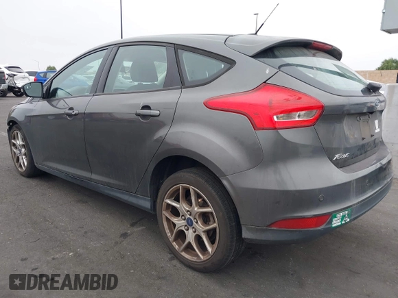 2015 Ford Focus SE with VIN 1FADP3K27FL387012, listed as a IAAI auction lot 42100945 with 85,588 mi miles. Bid and sale history available at carsss.com. Image 3.