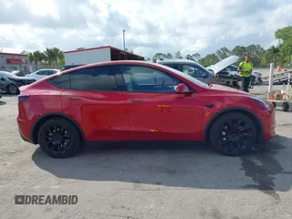 2023 Tesla Model Y Long Range with VIN 7SAYGDEE1PA154996, listed as a IAAI auction lot 41472595 with 24,861 mi miles and . Bid and sale history available at DreamBid. Image 13.