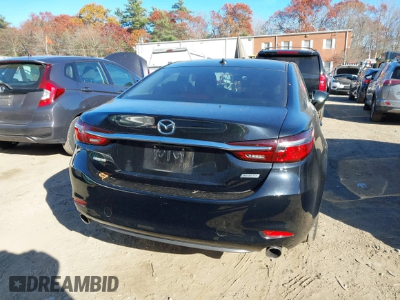 2018 Mazda 6 Grand Touring with VIN JM1GL1TY0J1319083, listed as a IAAI auction lot 40852818 with 57,408 mi miles and . Bid and sale history available at DreamBid. Image 16.