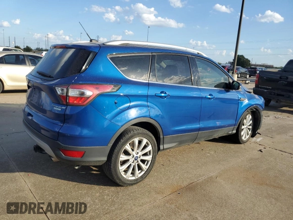 2017 Ford Escape Titanium with VIN 1FMCU0JD2HUB21261, listed as a Copart auction lot 76607264 with 130,796 mi miles and Salvage Title. Bid and sale history available at carsss.com. Image 3.