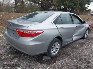 2015 Toyota Camry Hybrid LE with VIN 4T1BD1FK9FU161942, listed as a IAAI auction lot 41880622 with 216,632 mi miles. Bid and sale history available at carsss.com. Image 4.