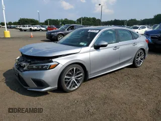 2022 Honda Civic Touring z VIN 2HGFE1F93NH301678, wystawiony jako Copart lot #59925755 z przebiegiem 52 318 mil mil oraz Czysty tytuł • Clean title. Historia ofert i sprzedaży dostępna na DreamBid. Obrazek 1.