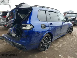 2025 BMW X7 M60i with VIN 5UX33EM0XS9X98693, listed as a IAAI auction lot 41009705 with 2,814 mi miles. Bid and sale history available at carsss.com. Image 4.