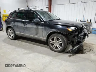 2011 Volkswagen Touareg Exec with VIN WVGFK9BP6BD006430, listed as a Copart auction lot 84288014 with 186,189 mi miles and Salvage Title. Bid and sale history available at DreamBid. Image 4.