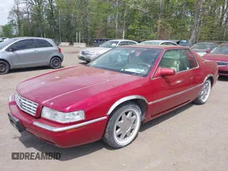 1997 Cadillac Eldorado Touring ETC z VIN 1G6ET1297VU600449, wystawiony jako IAAI lot #42096992 z przebiegiem 185 918 mil mil oraz . Historia ofert i sprzedaży dostępna na DreamBid. Obrazek 2.