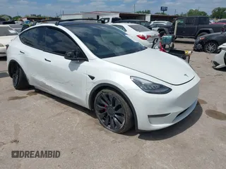 2021 Tesla Model Y Performance with VIN 5YJYGDEF9MF081798, listed as a IAAI auction lot 42033358 with 64,679 mi miles and . Bid and sale history available at DreamBid. Image 1.