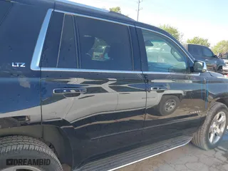 2015 Chevrolet Tahoe LTZ with VIN 1GNSCCKCXFR117525, listed as a IAAI auction lot 41839259 with 143,413 mi miles. Bid and sale history available at carsss.com. Image 14.